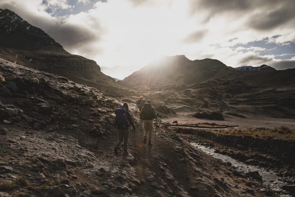 Trekkers hiking up to a high pass on the Ausangate Trek.