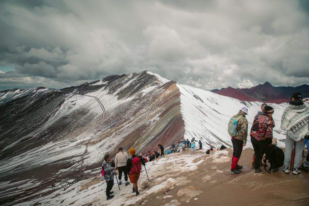 Visitors at Rainbow Mountain after it's snowed