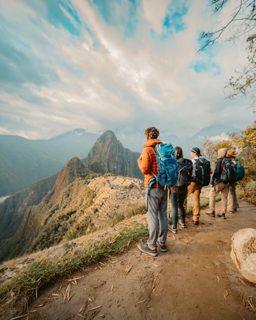 DGroup of tourists viewing the magnificent Inca citadel of Machu Picchu